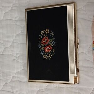 Vintage cigarette case with lighter.  Measurements are " long and 3.5" wide.